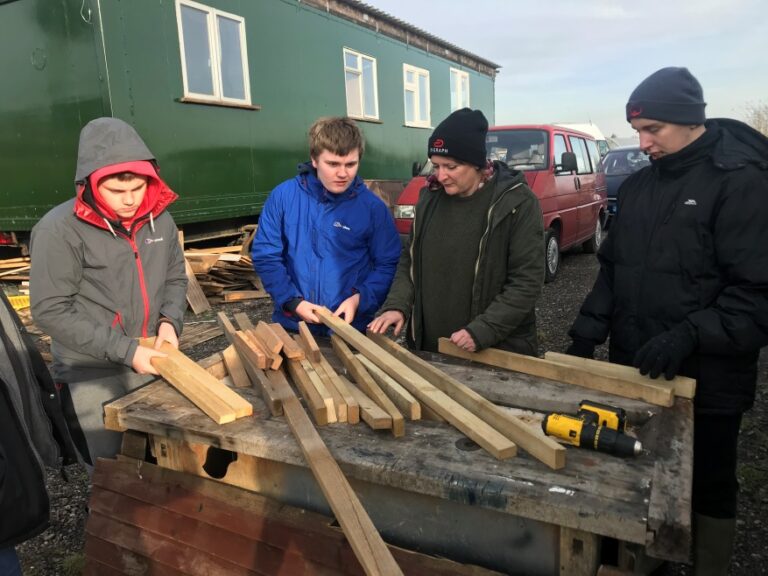 Toby, Corey and DJ learning how to cut wood