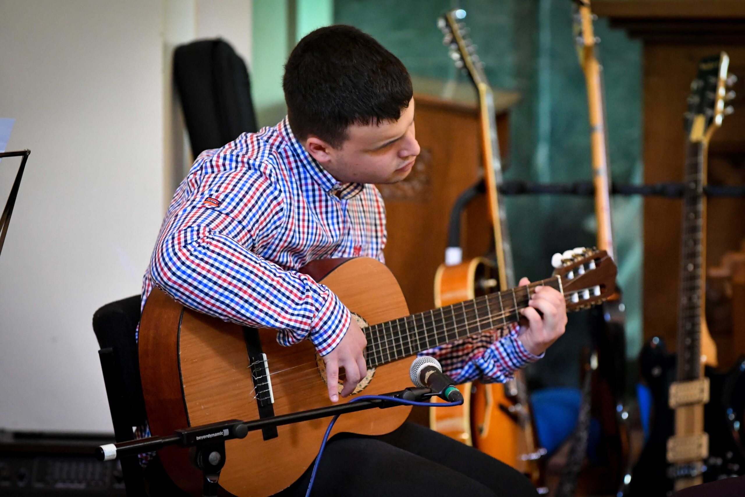 Student playing guitar