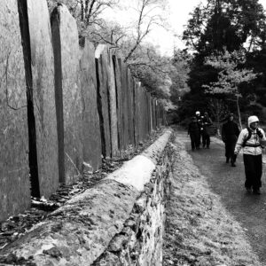 Black and white photograph of the group plodding on