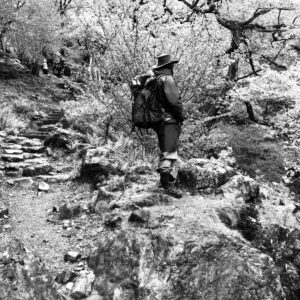 Another black and white view of staff member Dan peering off into the distance