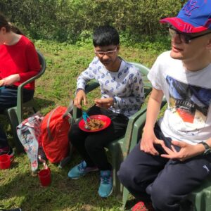 Sonali enjoying her campfire stew