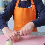 Student is cutting up boiled eggs