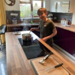 Student boiling potatoes on the hob