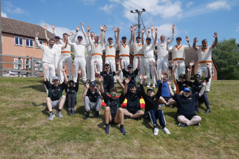 MCC and NCW group photo, arms in the air!