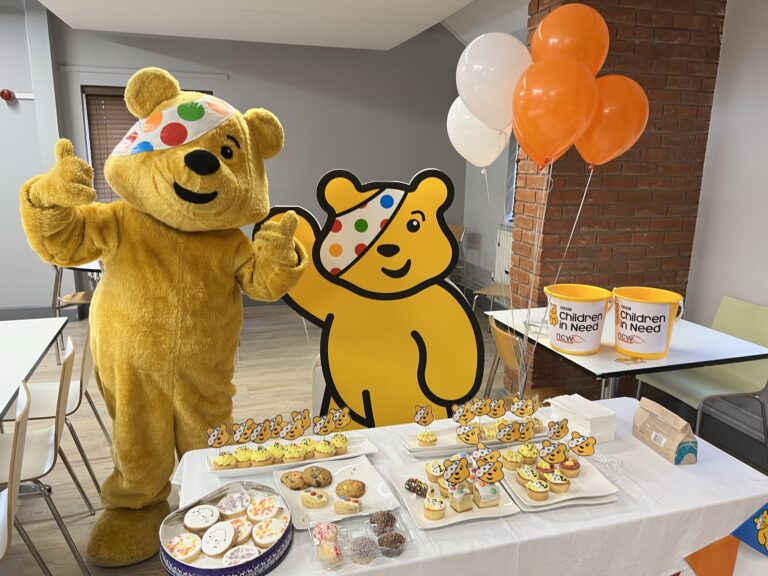 Pudsey with his table of Pudsey treats and cakes!