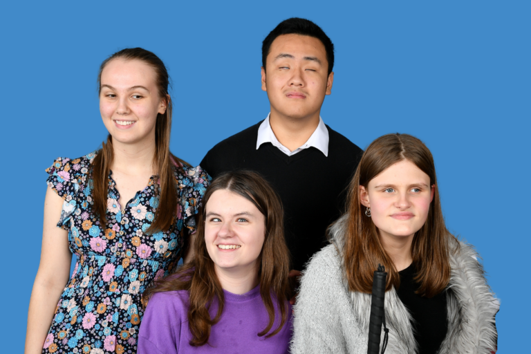 group image of the four students smiling