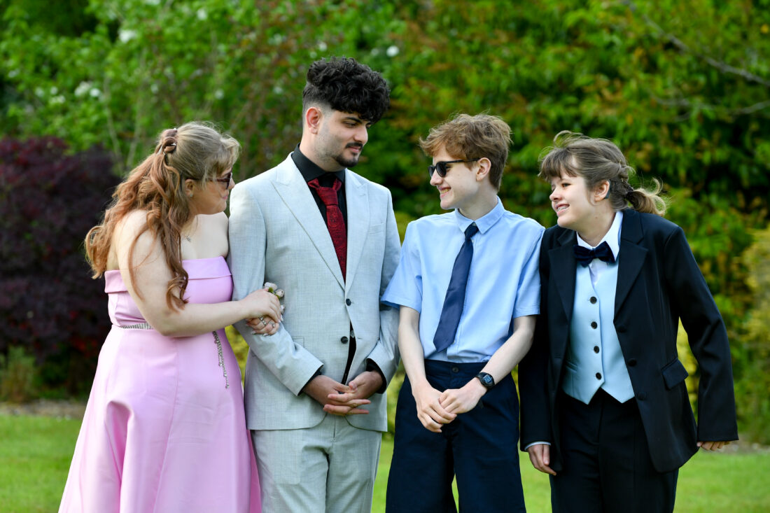 image of four students smiling