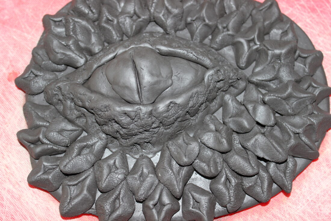 close up of the dragon's eye which is made of black clay