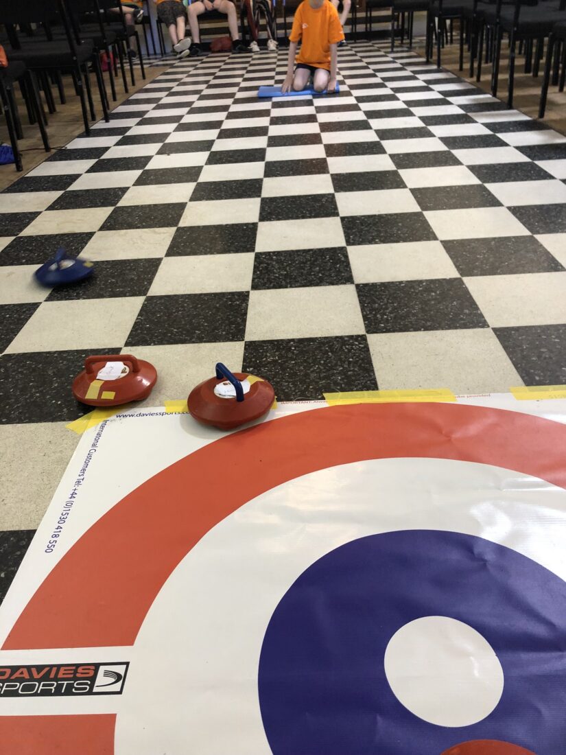 Image shows a boccia target with young people playing