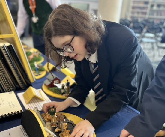 image of a student exploring a tactile display