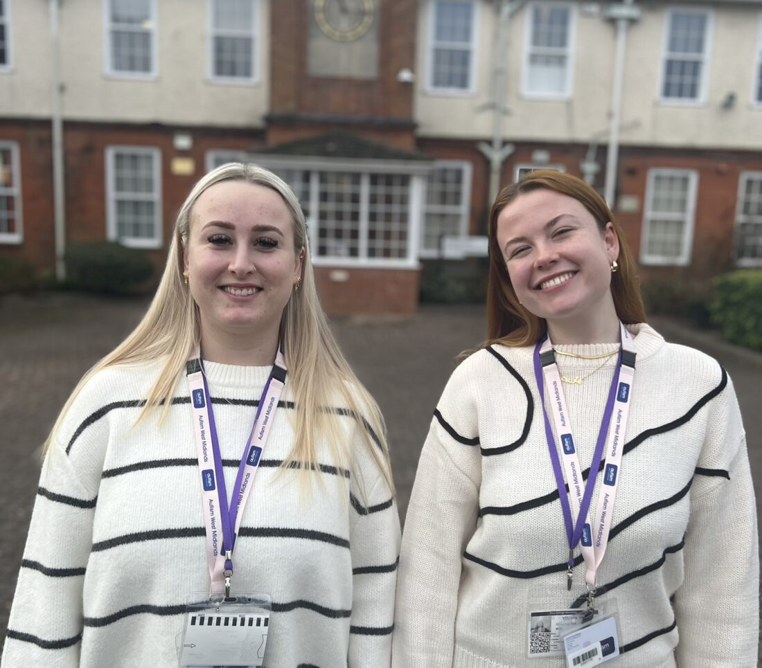 Image of two West Midlands Autism Advisors smiling at the camera with the school building in the background